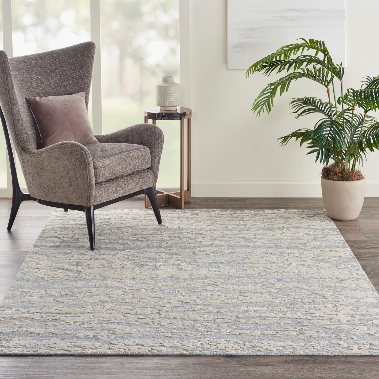 Rectangular gray and cream textured area rug (6' x 8') with a subtle wavy pattern, ideal for living rooms.