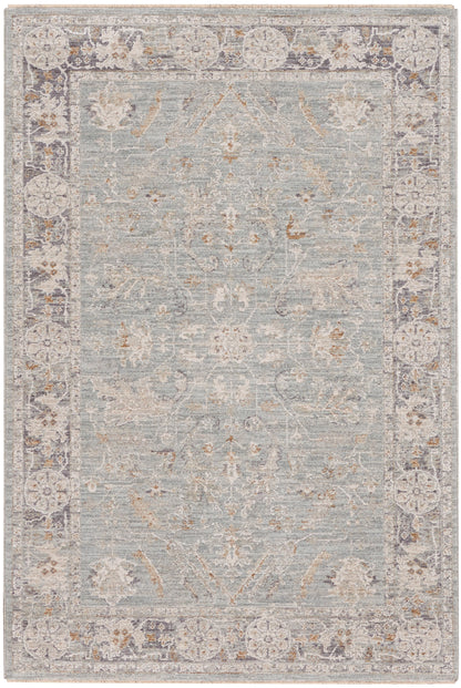Rectangular distressed blue-gray oriental rug with ivory floral border and taupe highlights, versatile living room accent.