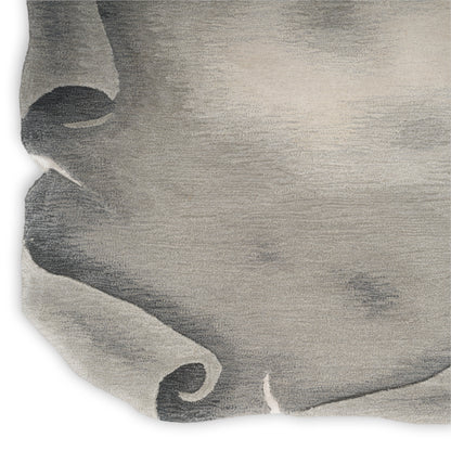 Grey linen-like textured rug in a soft neutral tone.