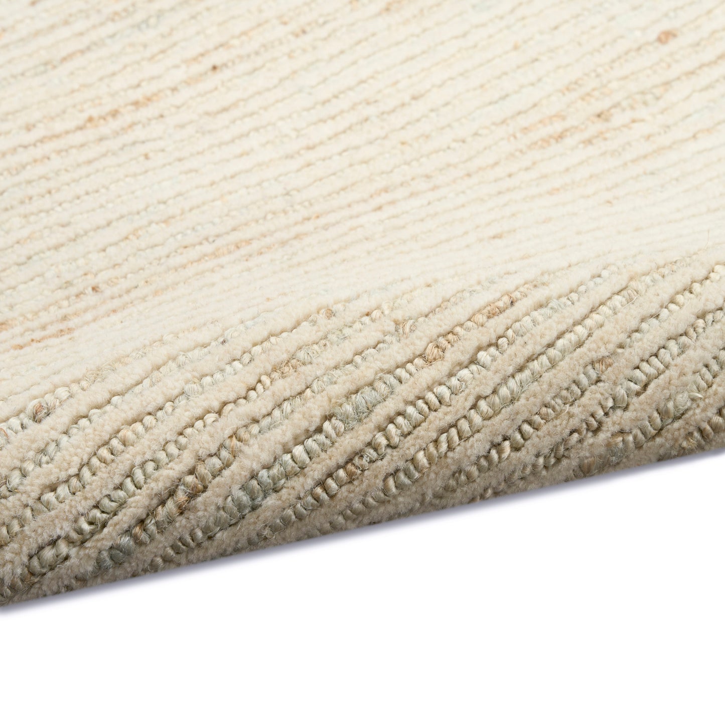 Soft cream textured rug with looped pile and rolled beige edge for neutral decor.