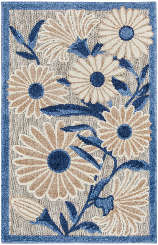 Rectangular woven rug with cream daisies, blue centers & leaves on gray background, blue border.