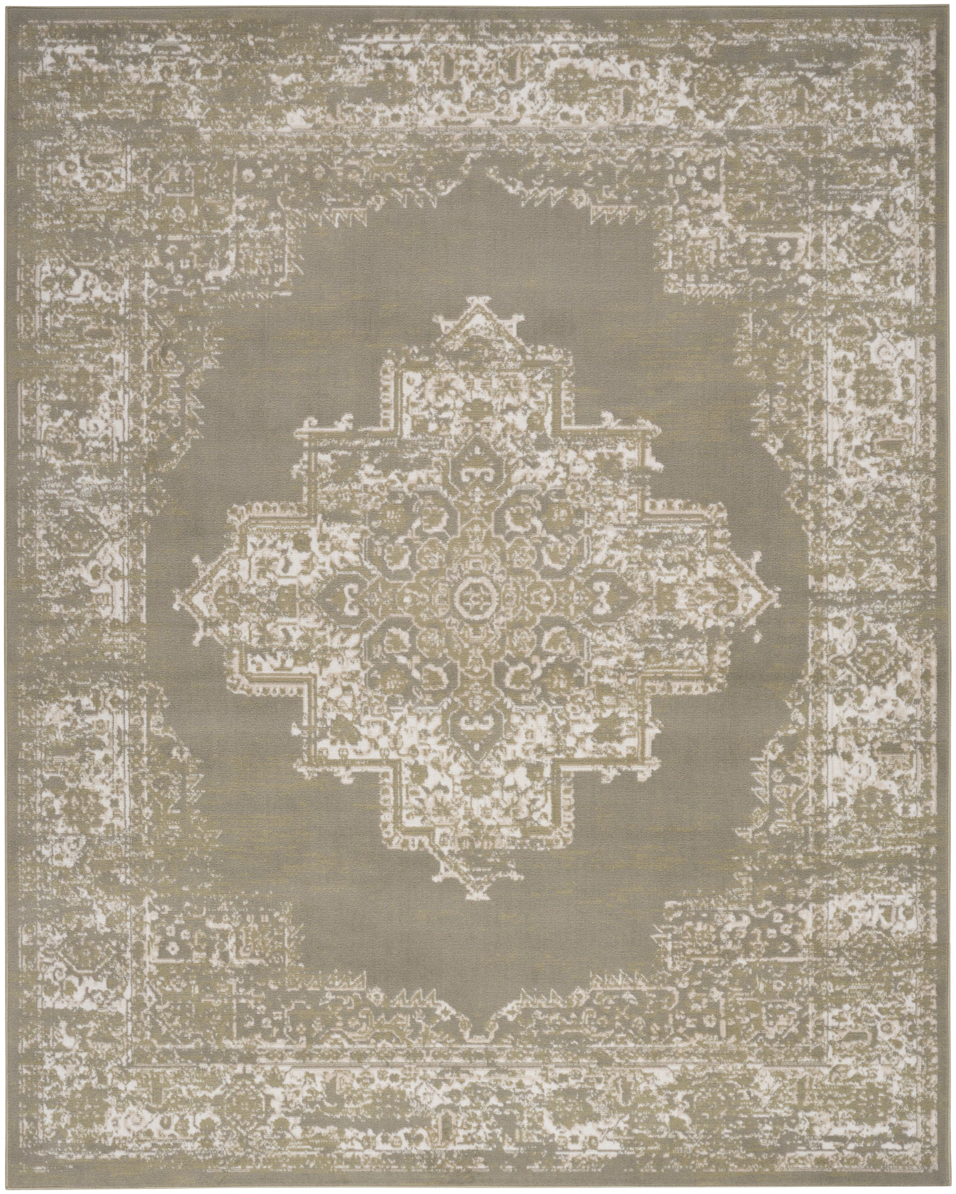 Beige distressed oriental rug with large central medallion and intricate border in muted tones.