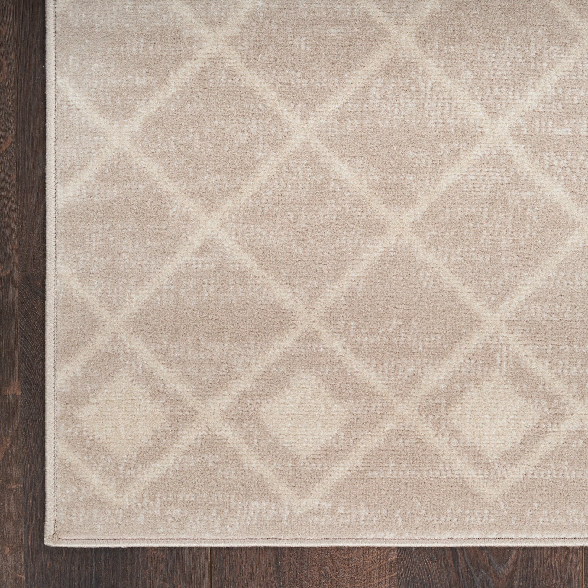 Beige Bohemian 6' runner rug with a subtle diamond lattice pattern and a light border on dark wood floor