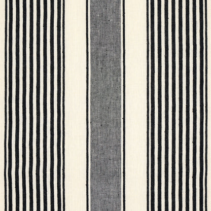 Vertical striped textile with bold black & ivory stripes and a central grey band; woven fabric for rug or upholstery.