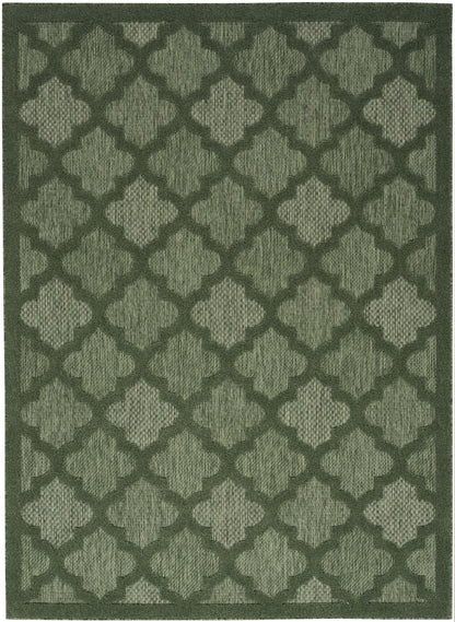 Olive-green trellis-pattern rug with geometric quatrefoil shapes in a textured woven pile.