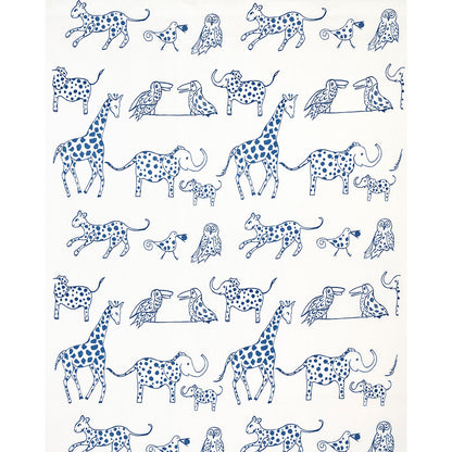 White fabric with a blue doodle safari print featuring giraffes, elephants, owls and small birds in a repeating pattern.