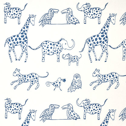 Blue line-drawn animal pattern with spotted dogs, giraffes, an elephant, birds and an owl on cream background