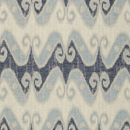 Ikat-inspired fabric featuring pale blue and navy wavy chevron on ivory background with a textured textile look.