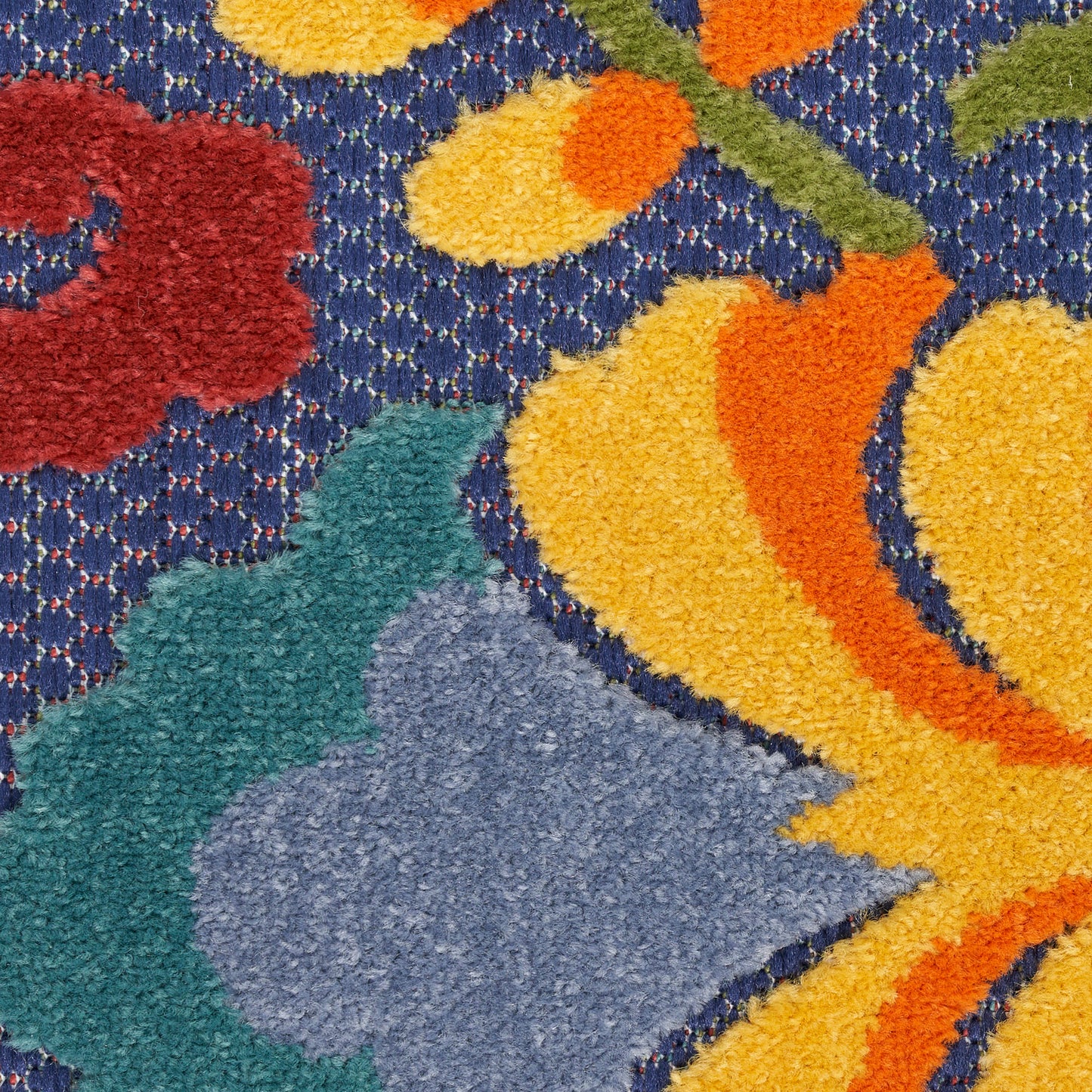 Colorful shaggy area rug with blue dotted background, bright yellow orange petals, red bloom & green leaves.