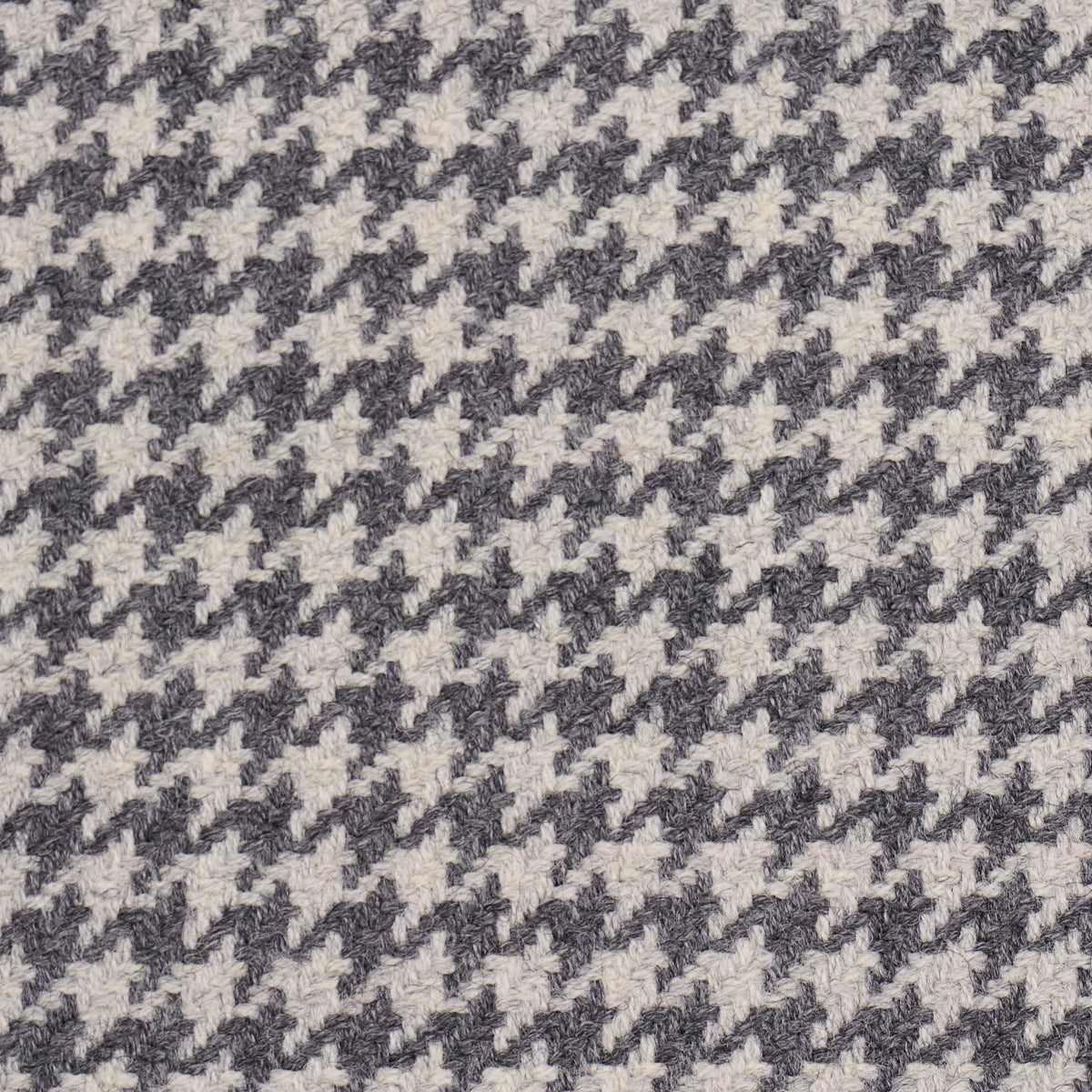 Houndstooth fabric pattern in black and gray, wool-like woven textile suitable for coats, jackets, and upholstery.