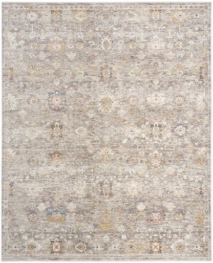 Distressed gray-beige area rug with a vintage floral medallion pattern and subtle ivory, blue, and yellow accents.