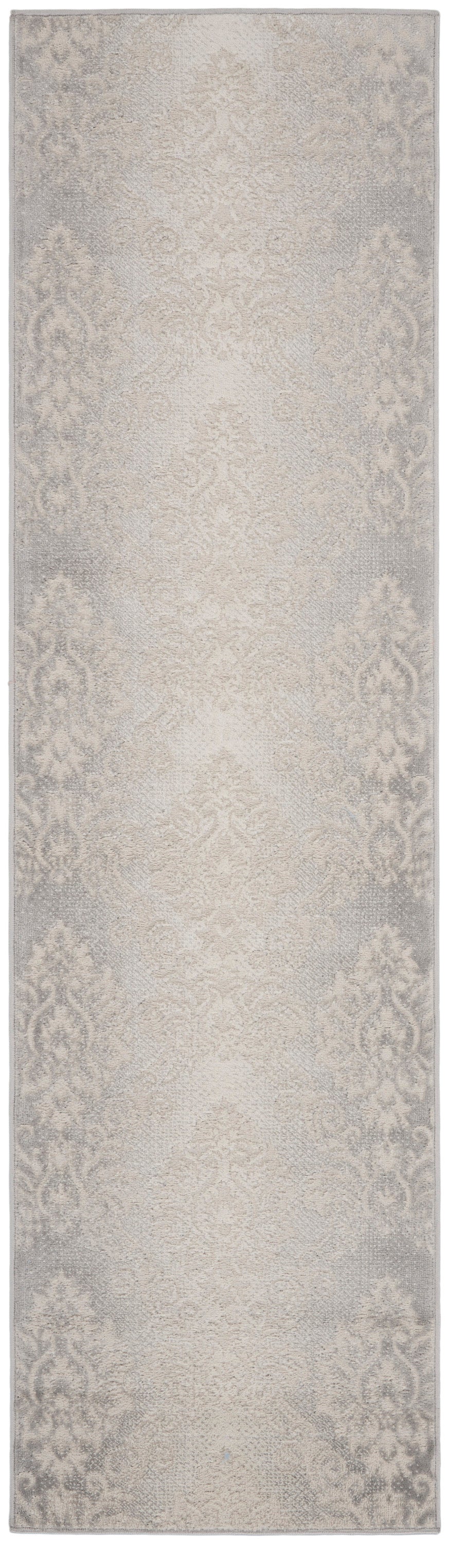 Beige runner rug with a subtle damask pattern in soft grey, decorative floor covering.