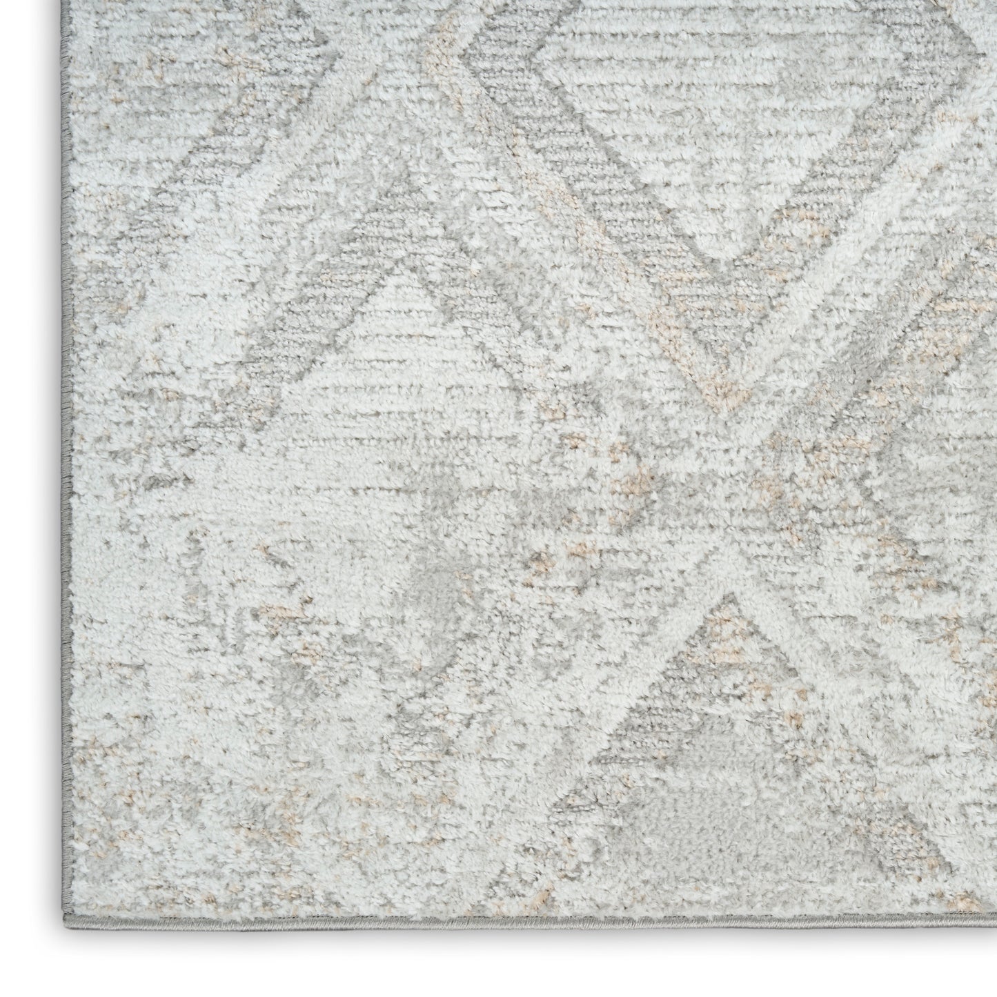 Light gray and ivory geometric area rug with subtle beige accents and soft plush texture.