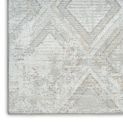 Light gray and ivory geometric area rug with subtle beige accents and soft plush texture.