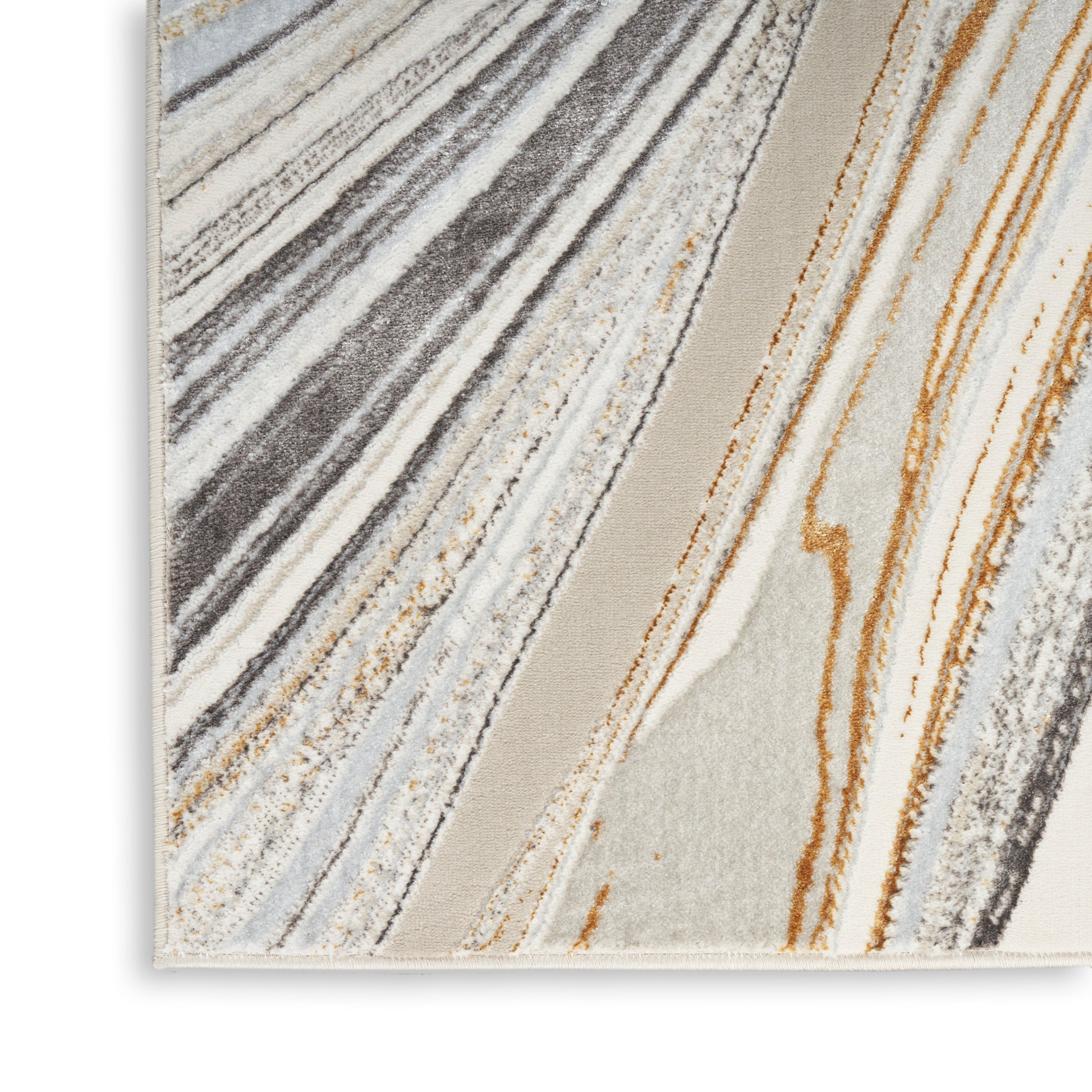 Diagonal striped area rug in neutral beige, gray, cream and rust tones with soft pile.