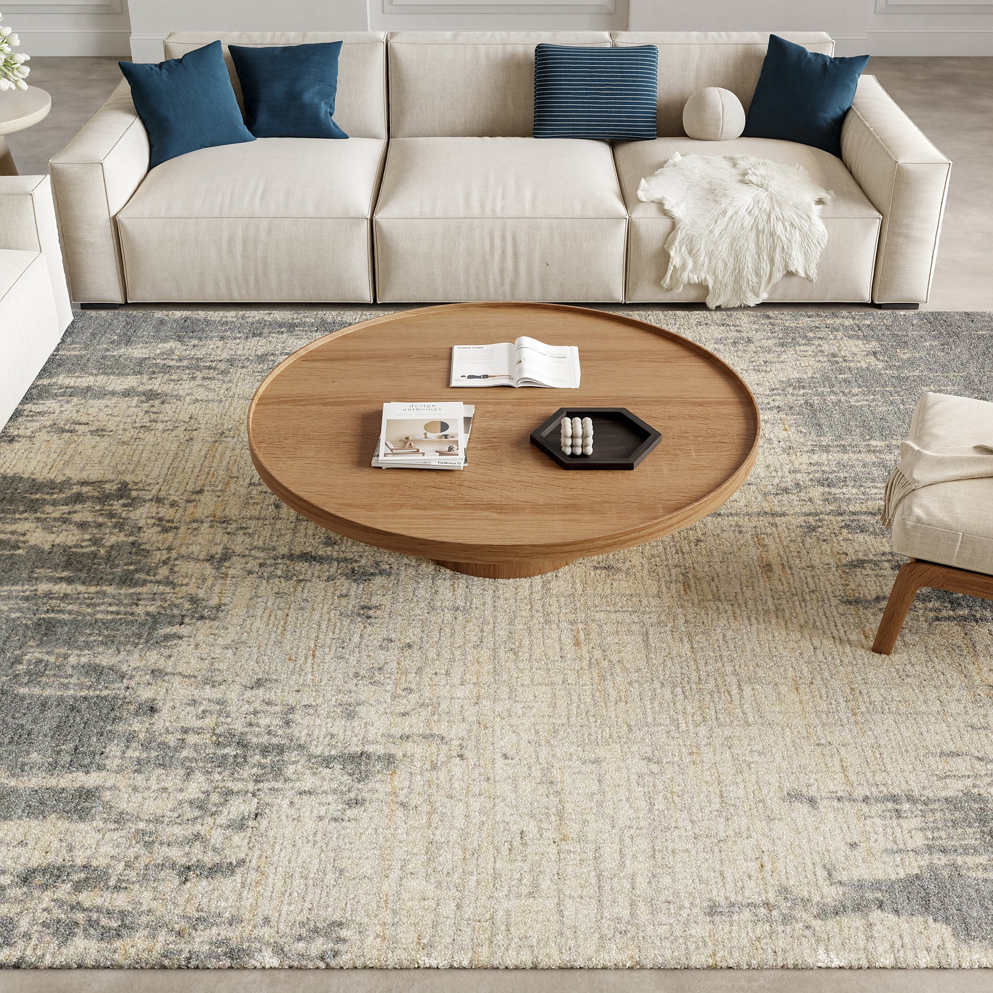 Light beige patterned rug, 10' x 14'.