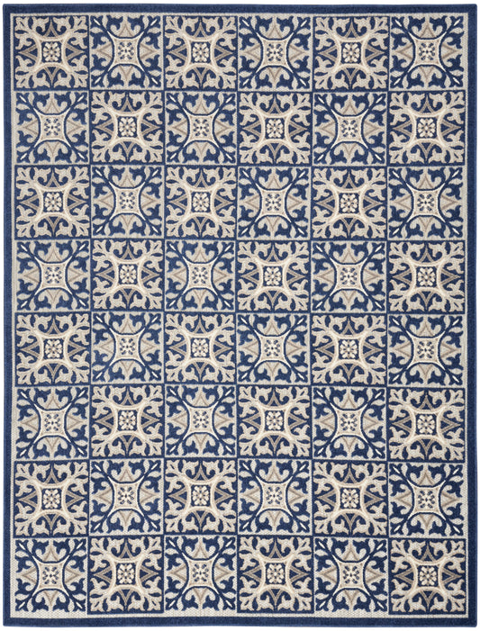 Rectangular rug in navy and cream with repeating square tile pattern and a dark blue border.