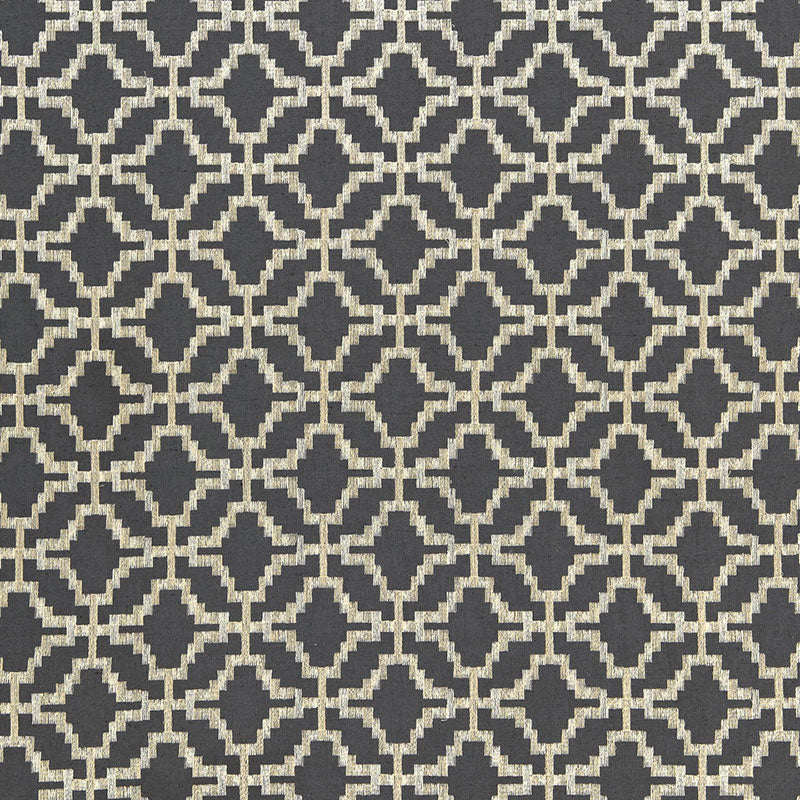 Dark charcoal background with cream geometric diamond lattice pattern; modern woven textile, rug-like motif.