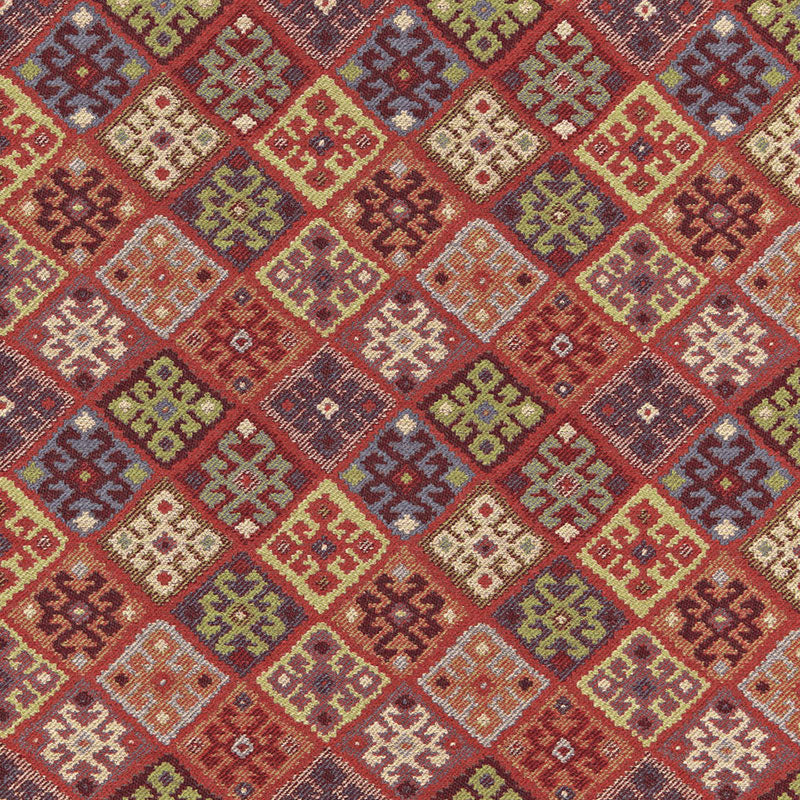 Colorful geometric kilim rug pattern with diamond motifs in red, orange, yellow, green and blue; woven wool.