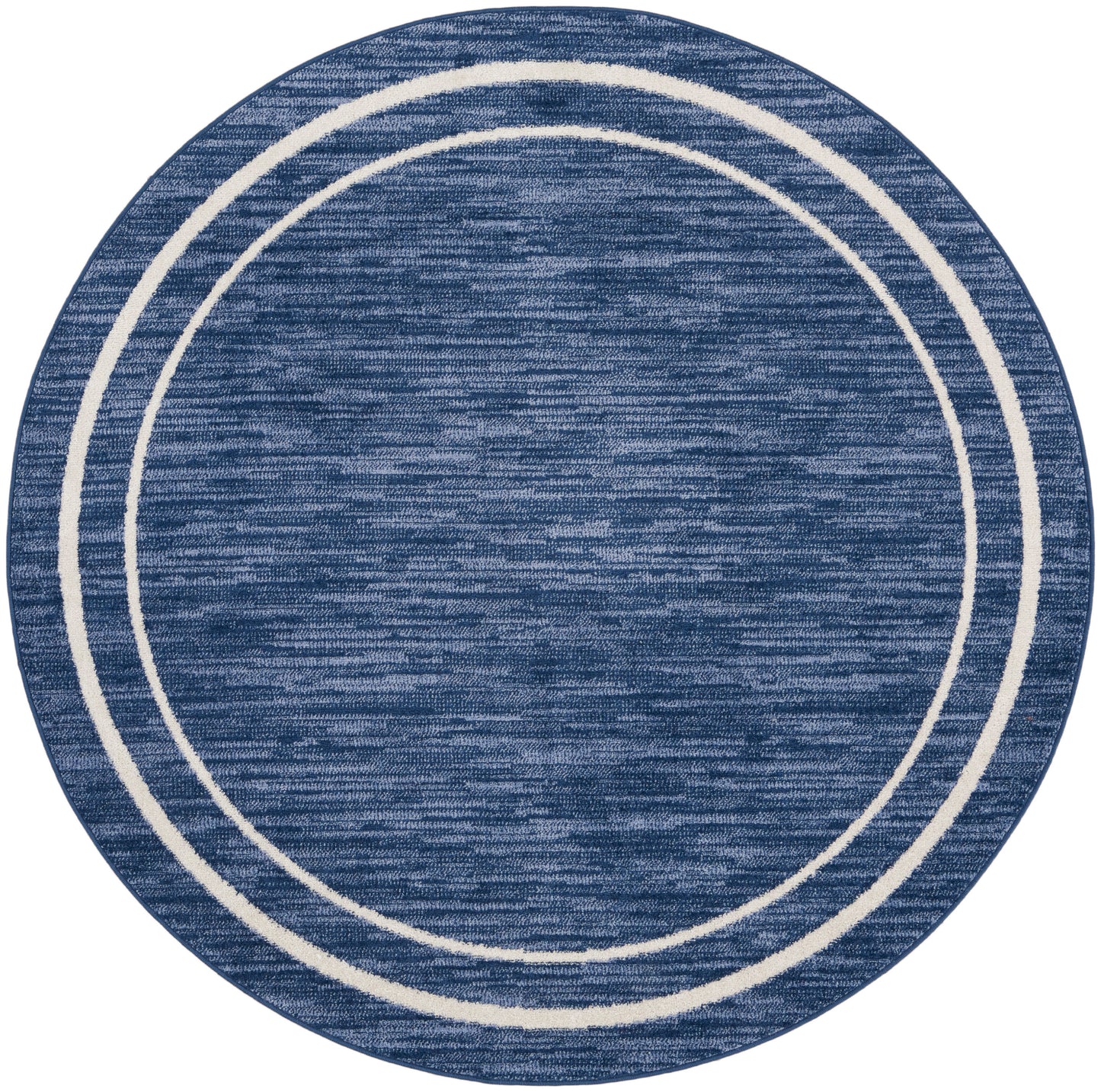 Blue round rug with cream concentric rings and a textured weave.