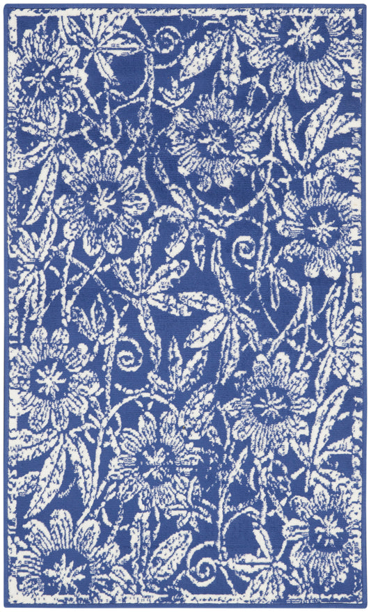 Blue textile with white floral damask pattern and vines; decorative fabric for towels, upholstery or drapes.