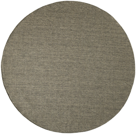 Round taupe woven rug with textured burlap-like weave; rustic circular floor accent.