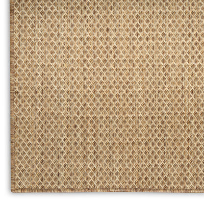 Beige woven natural fiber rug with diamond lattice texture & stitched border.
