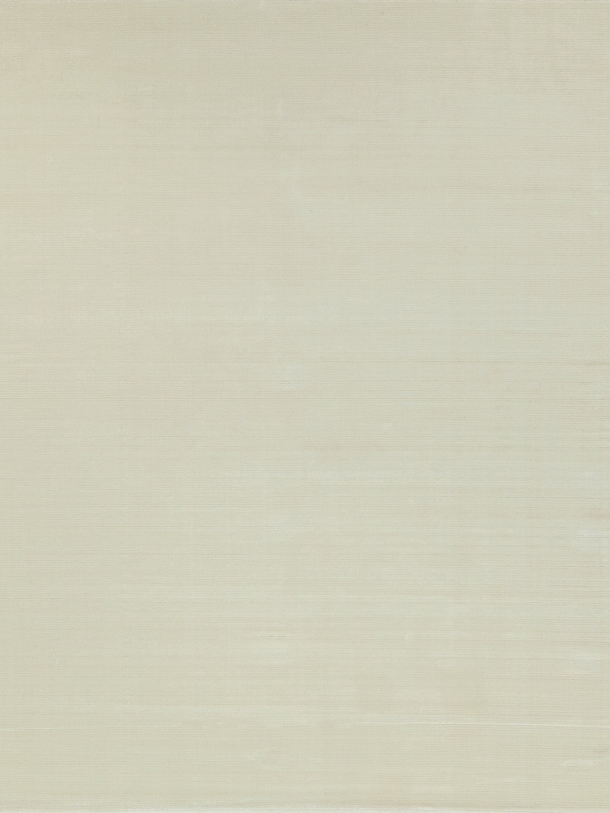 Neutral beige rug with a subtle textured weave; hand-loomed construction and a creamy linen-like appearance.