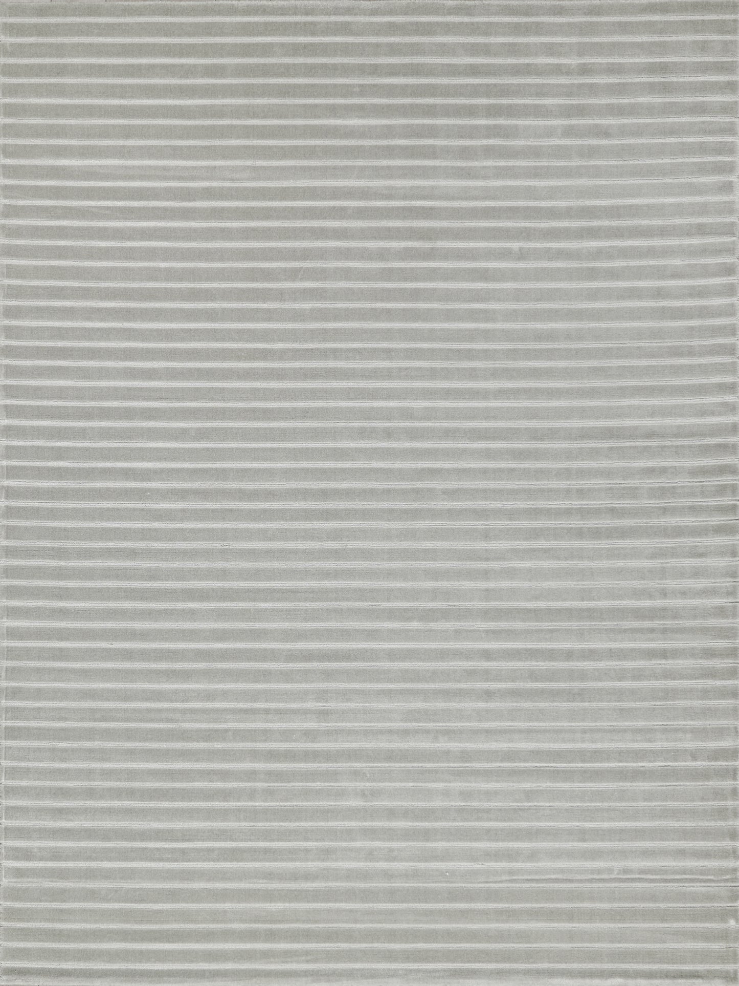 Gray rectangular rug with thin white horizontal stripes; soft plush textile for living room decor.