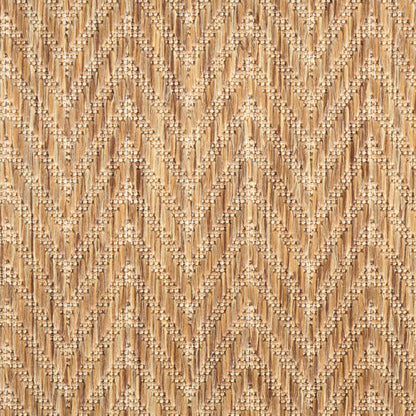 Beige jute area rug with chevron zigzag pattern and tiny white beaded accents along the ridges.