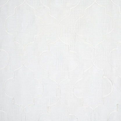Light gray fabric with white embroidered quatrefoil lattice pattern; subtle linen texture, versatile home decor textile.