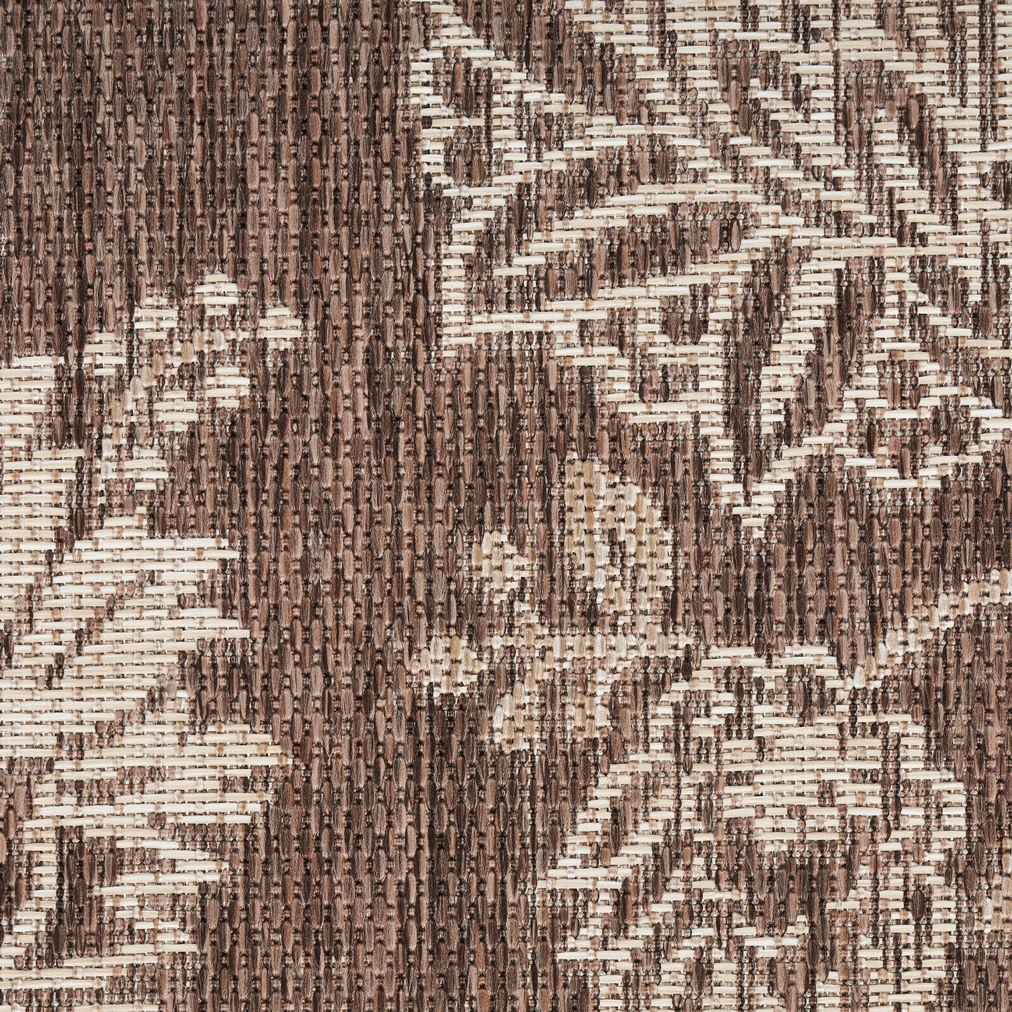 Brown and beige damask-style woven rug with floral vine pattern and textured loop pile.