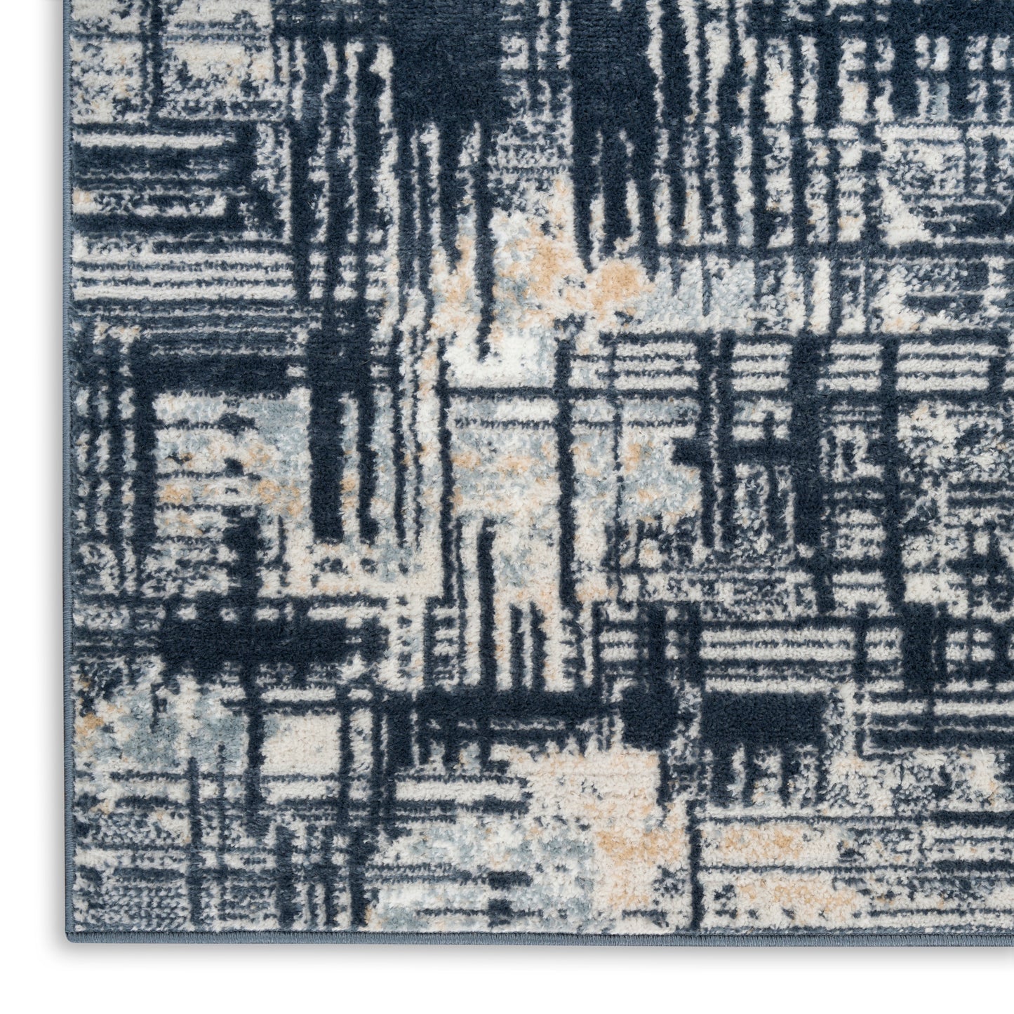 Abstract navy, cream, gray & ochre geometric area rug with a textured pile.