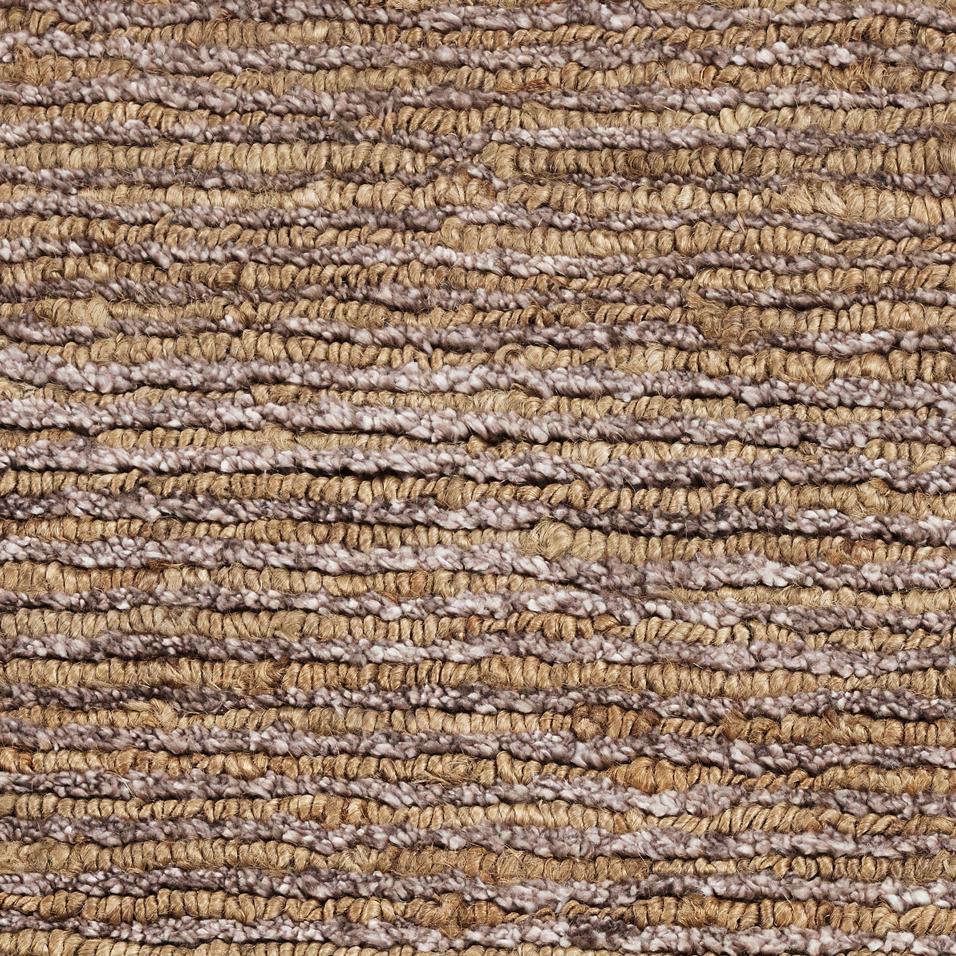 Close-up of textured woven rug with ribbed twisted yarns in brown, tan and beige tones.