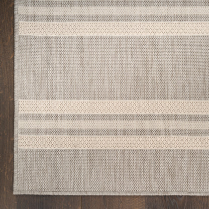 Flat-weave rug with ivory and gray stripes, textured weave for a casual contemporary look.