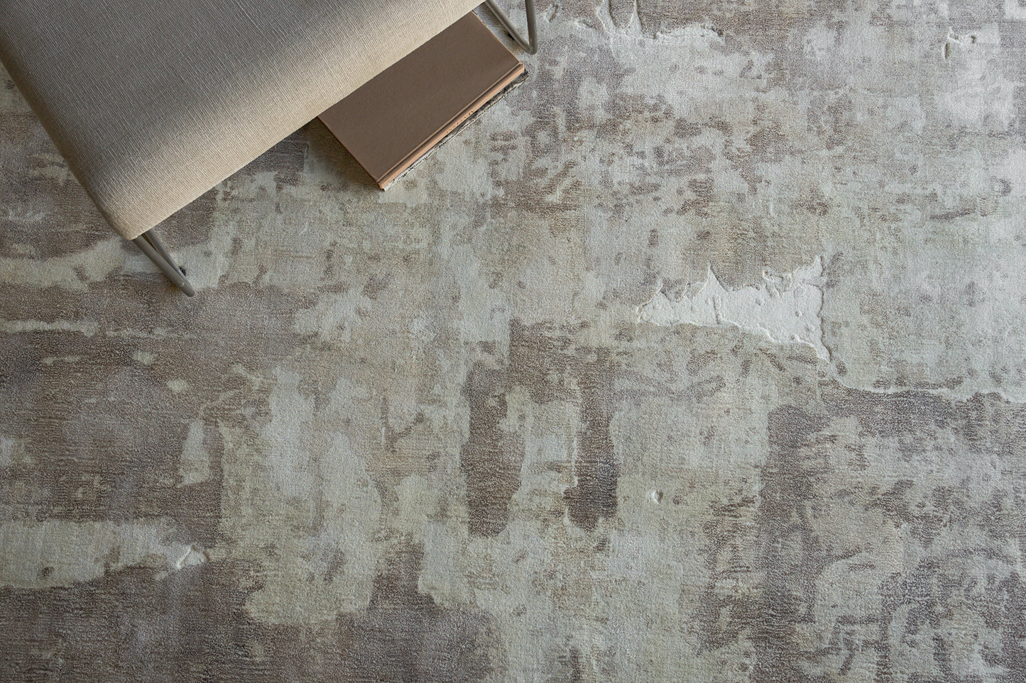 Beige indoor hand loomed rug, 4' x 6', on a weathered gray floor.