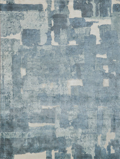 Blue-toned abstract patchwork area rug with distressed ivory patches, modern contemporary design.