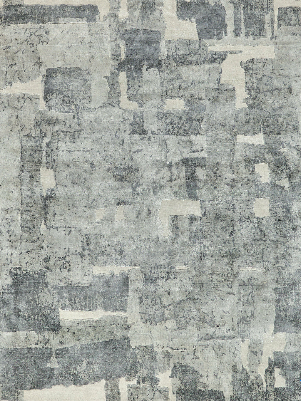 Rectangular abstract distressed patchwork rug in gray-blue and ivory tones for living room decor.