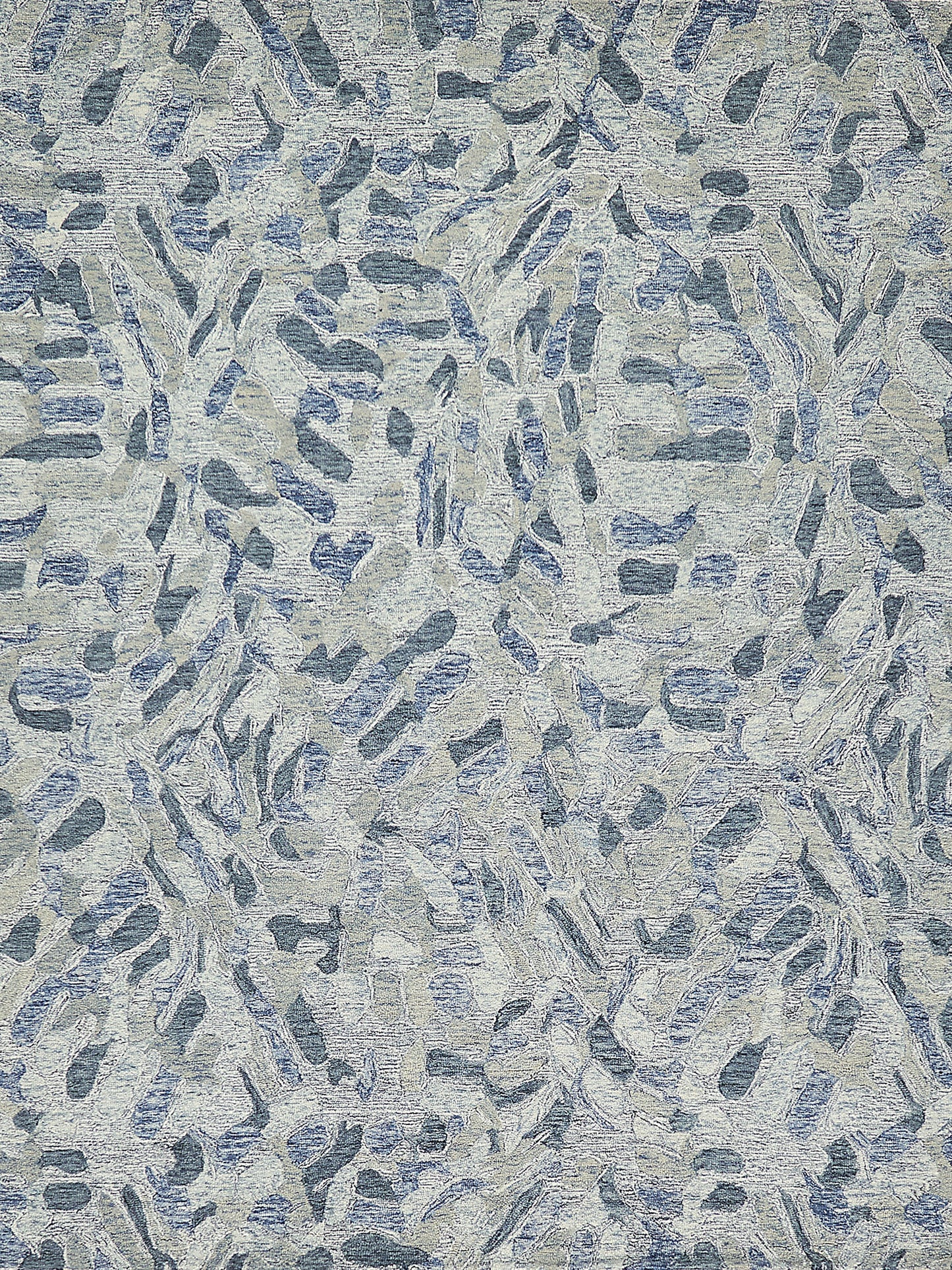 Abstract blue-gray rug with elongated brushstroke shapes; textured hand-tufted surface.