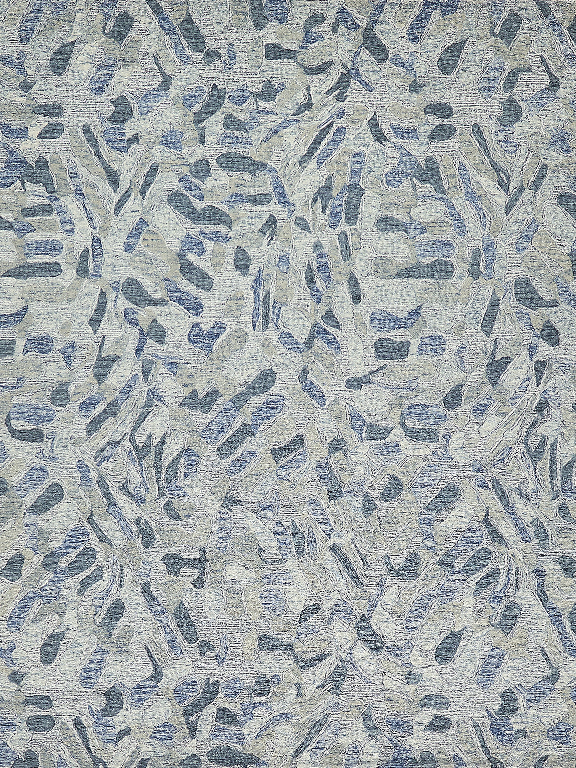 Abstract blue-gray rug with elongated brushstroke shapes; textured hand-tufted surface.