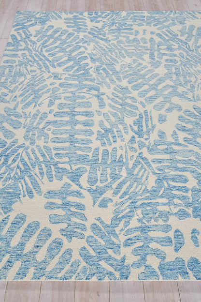 Blue and ivory abstract rug with elongated brushstroke patterns across the surface.