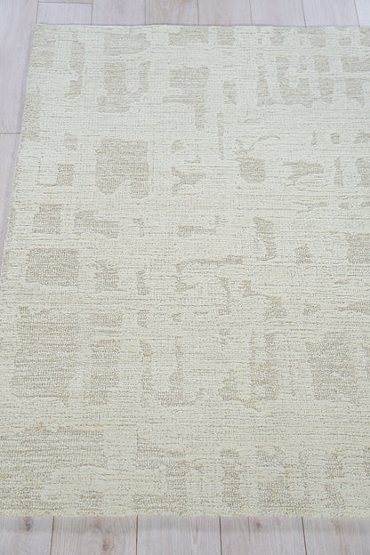 Beige rectangular rug with a soft, textured pile and subtle cream abstract pattern; neutral, modern decor.