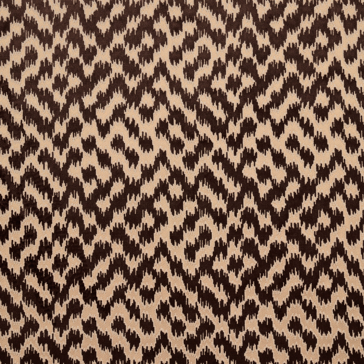 Brown & beige animal-print fabric with jagged geometric spots; woven texture, versatile for fashion or upholstery.
