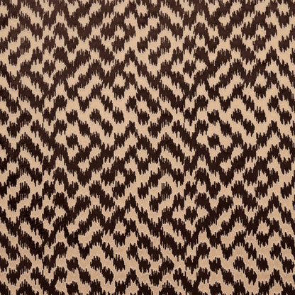 Brown & beige animal-print fabric with jagged geometric spots; woven texture, versatile for fashion or upholstery.