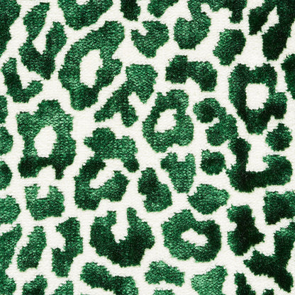 Emerald green leopard print plush fabric on white base with a bold textured pattern.