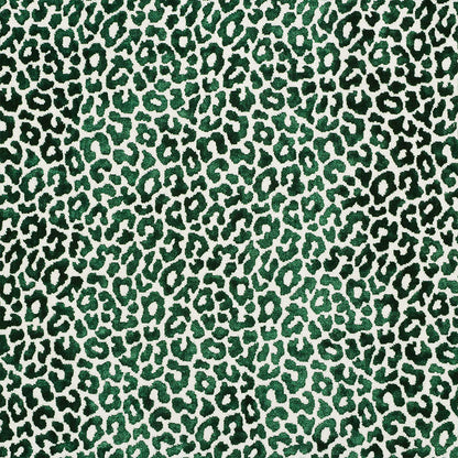 Emerald-green leopard print fabric with dark green spots on a cream background, bold animal pattern.