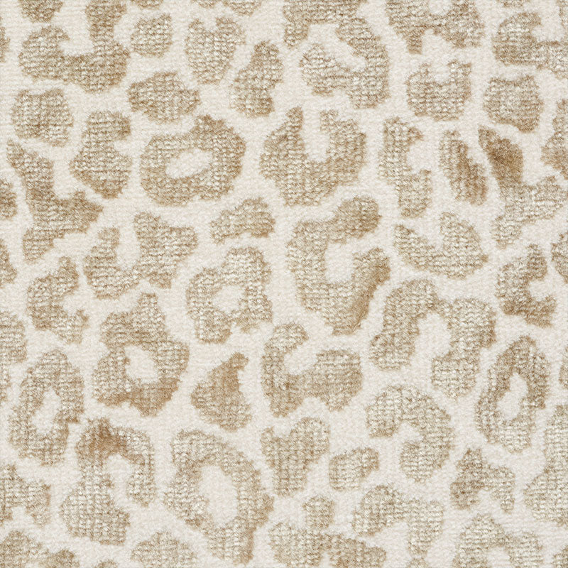 Cream-colored fabric with tan leopard spots in a plush boucle texture.