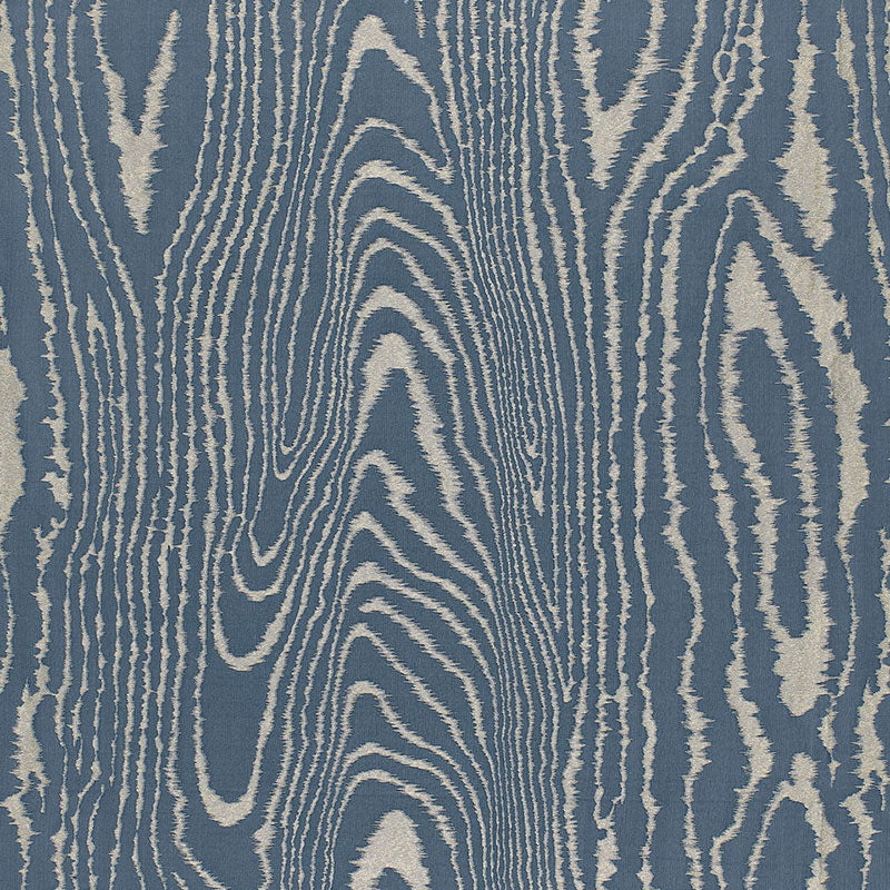 Blue fabric with cream irregular woodgrain pattern; modern upholstery textile.