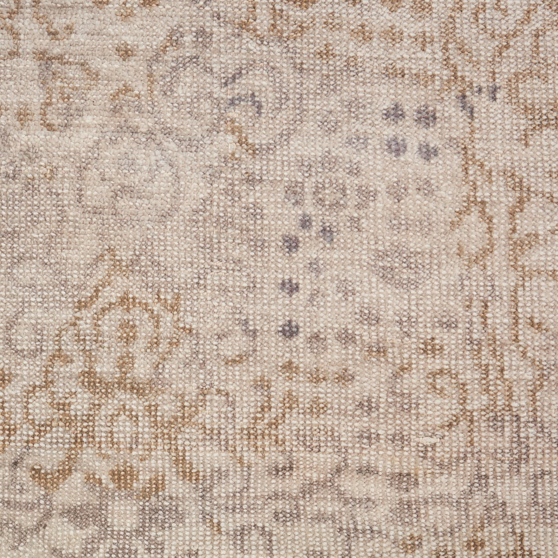 Ivory woven rug with beige vintage floral arabesque pattern and subtle grey accents.