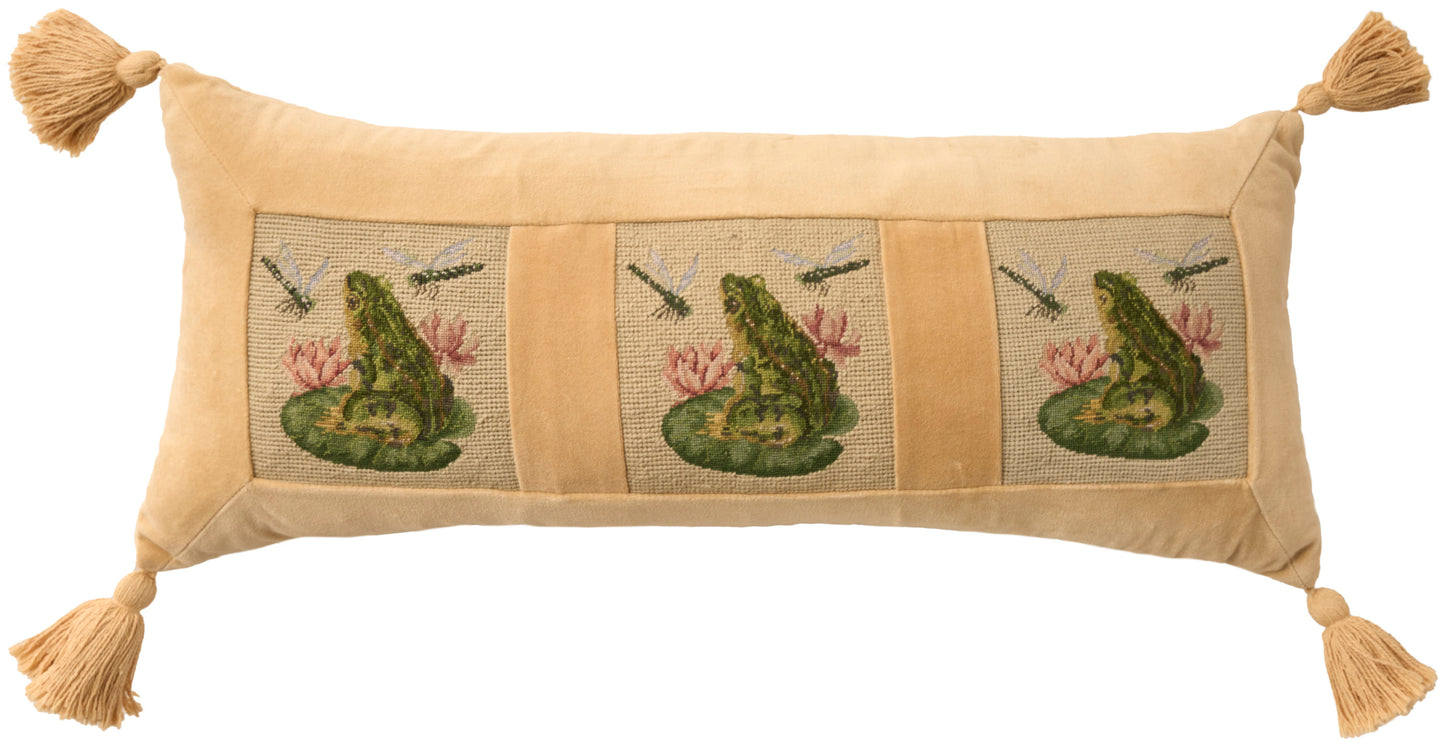 Golden tan decorative bolster pillow with three embroidered panels of a frog on a lily pad, and tassels at the corners.